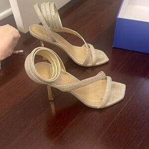 Gold/silver sparkly Stuart weitzman heels that wrap around ankle coming up.